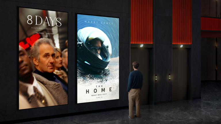 man looking at digital signage at a cinema