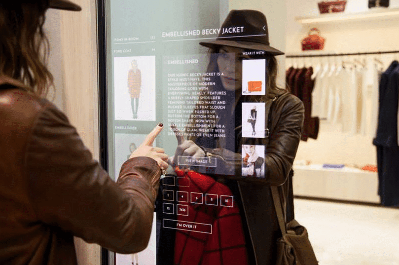 woman touching a digital signage